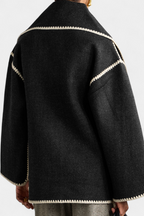 Pauline | Cappotto dal taglio morbido con sciarpa a frange incorporata