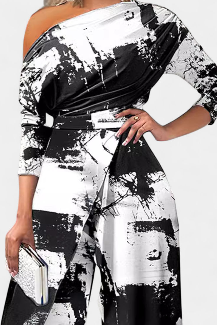 Tuta lunga tie-dye con spalle scoperte e spacco sulla gamba ampia